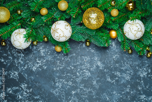 Fotografie Christmas or New Year decoration background: fur-tree branches, colorful glass b