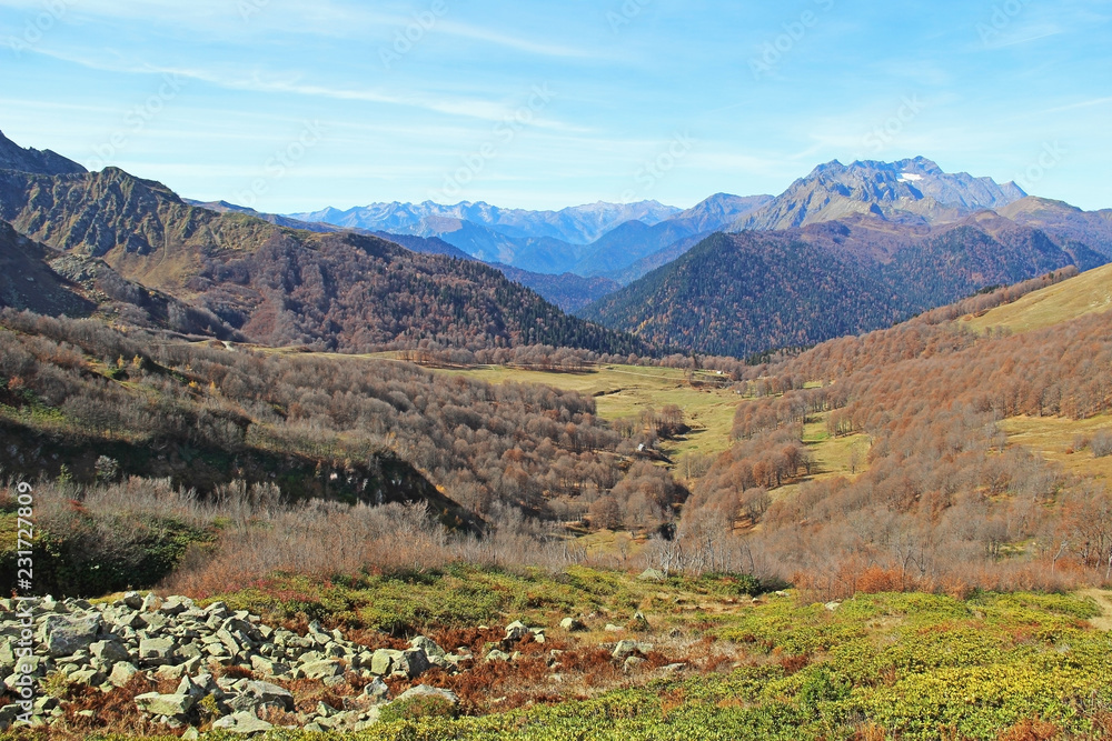 Panorama with yellow autumn hills and mountains. Abkhazia.