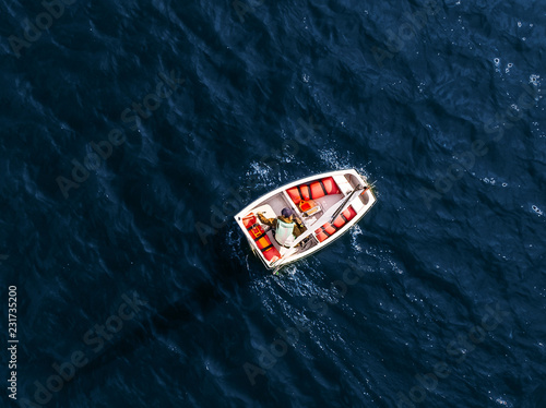 Aerial drone competitions sport white yachts and boats on blue water of sea.