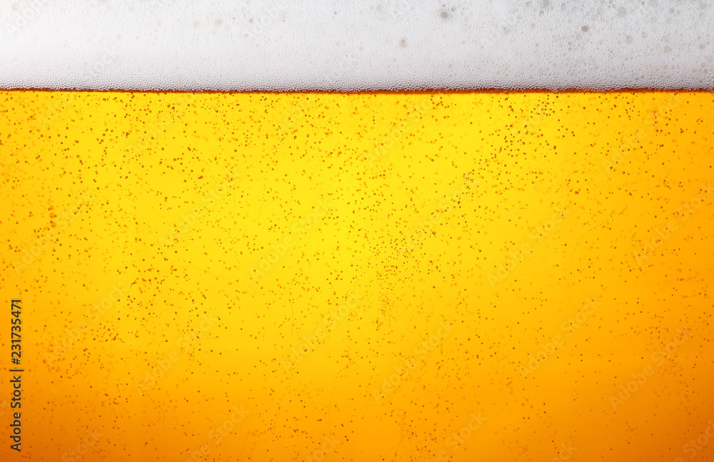 Close up background of beer with bubbles in glass Close up background of beer with bubbles in glass