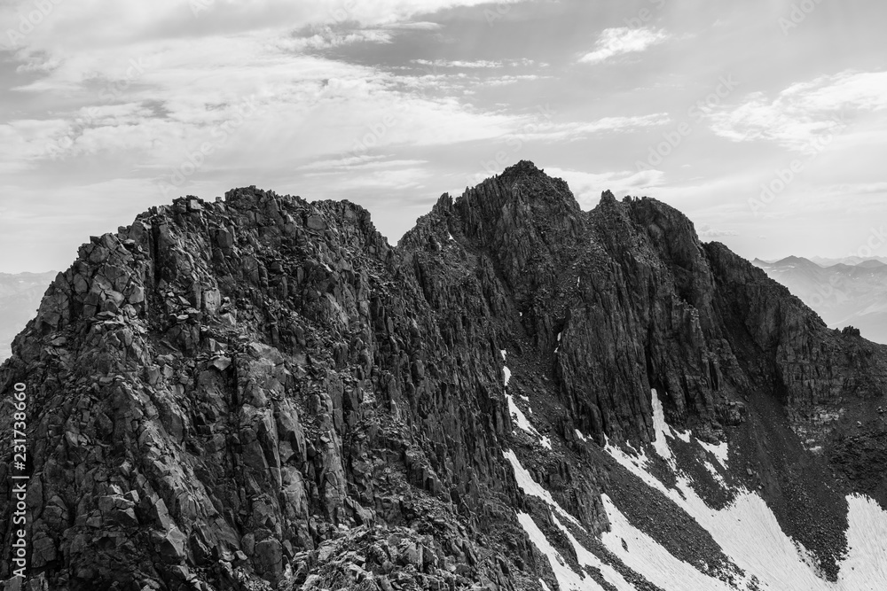Black and white photo of the traverse between El Diente Peak and Mt. Wilson. This scary, crumbly ridge is located near Telluride, Colorado Rocky Mountains.