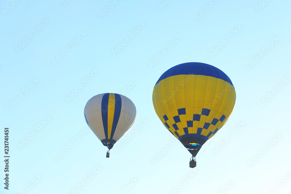 Fototapeta premium Colorful hot air balloons flying in blue sky