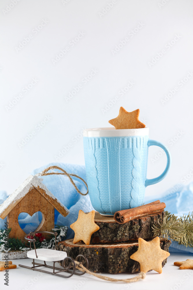 blue mug, ginger cookies and Christmas symbols on white background. New year's composition 2018 blue mug, ginger cookies and Christmas symbols on white background. New year's composition 2018
