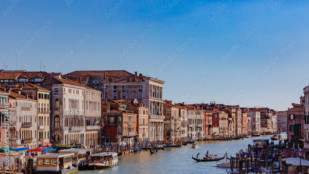 Venetian houses by Grand Canal, viewed from Rialto Bridge, in Venice, Italy