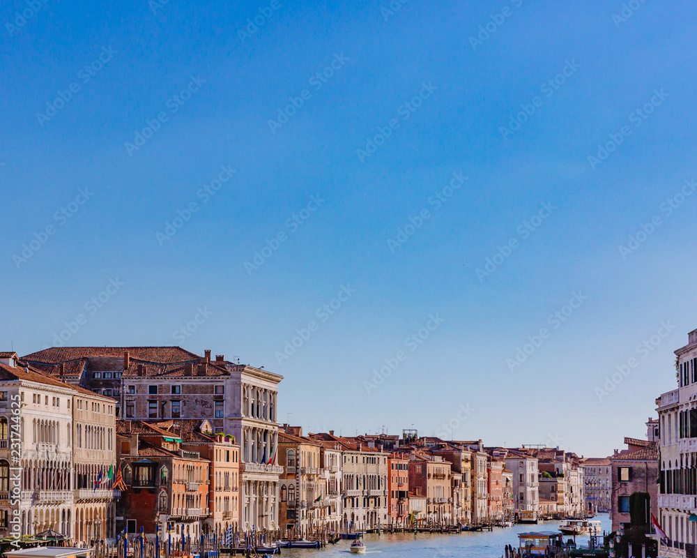 Venetian houses by Grand Canal, viewed from Rialto Bridge, in Venice, Italy