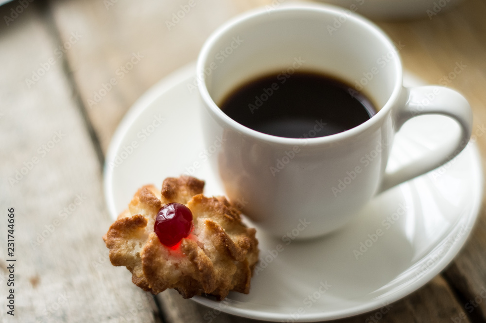 Sweet homemade cookies and cup of coffee on the table, selective focus and copyspace Sweet homemade cookies and cup of coffee on the table, selective focus and copyspace