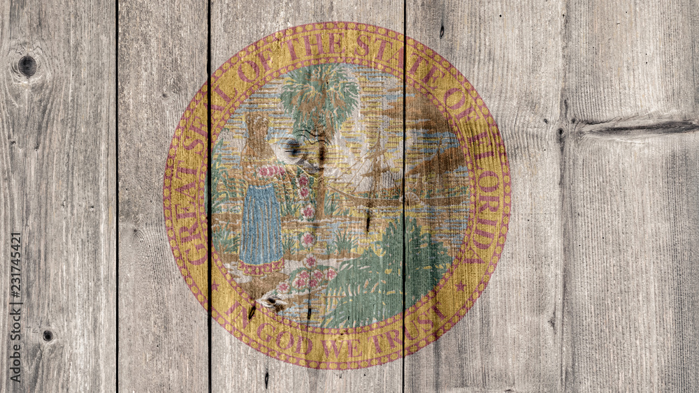 USA Politics News Concept: US State Florida Seal Wooden Fence Background USA Politics News Concept: US State Florida Seal Wooden Fence Background