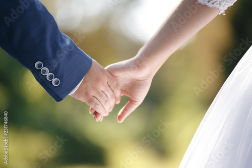 Close-up of married couple's hands