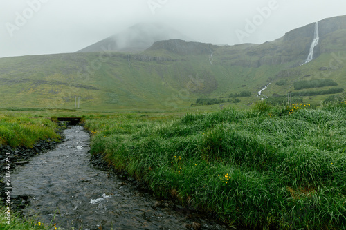 View at the stream of spectacular Bjarnarfoss waterfall in Iceland photo