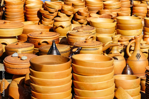 traditional Georgian handmade clay pottery on display at street market © Zigmunds