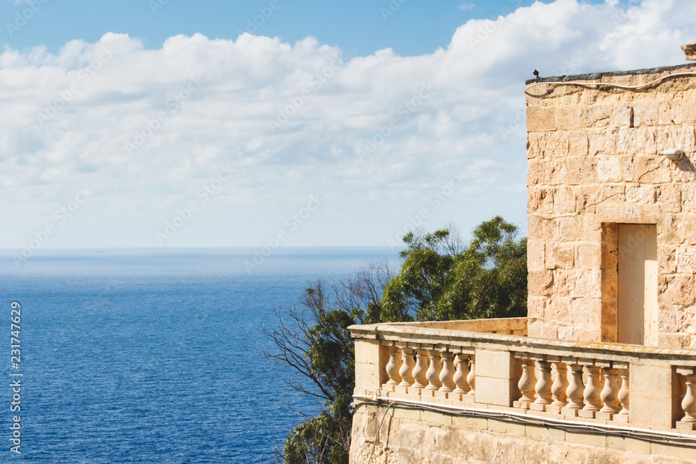 Balcony of a rural villa looking onto the blue Mediterranean sea