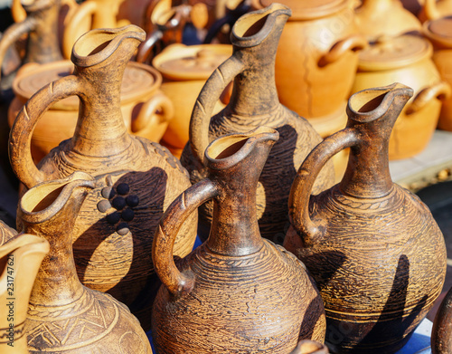 traditional Georgian handmade clay pottery on display at street market