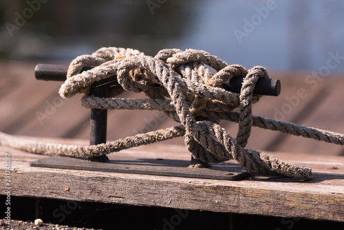 Obraz na plátně the rope wound on the cross cleat on the pier