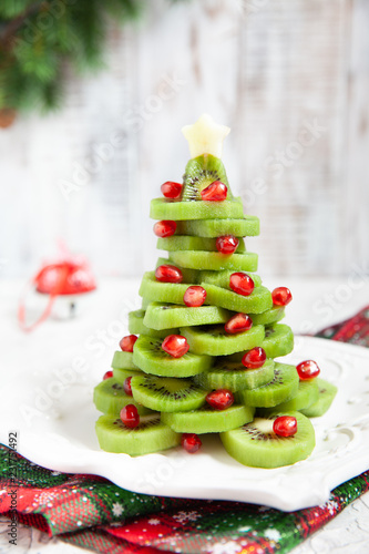 Kiwi pomegranate Christmas tree, beautiful New Year background