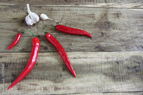 red chili peppers on wooden background