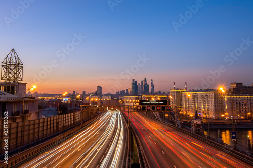 Third transport ring in Moscow, sunset view with tracers and traffic, and "Moscow city".