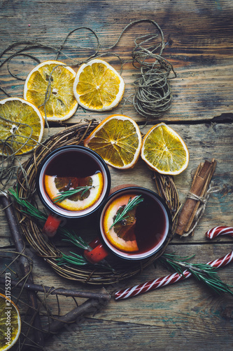 Christmas drink (winter hot drink). Mulled wine punch and spices for glintwine on vintage wooden table background top view.