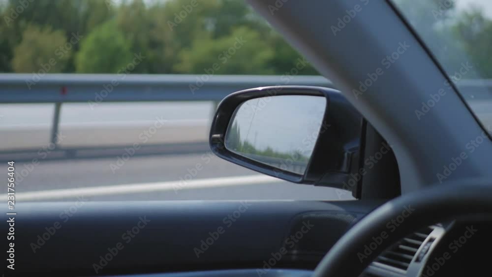 Landscape in the side view mirror of a car, on road countryside. Landscape in the side view mirror of a car, on road countryside.
