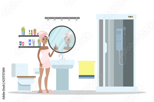 Woman after a shower standing in bathroom