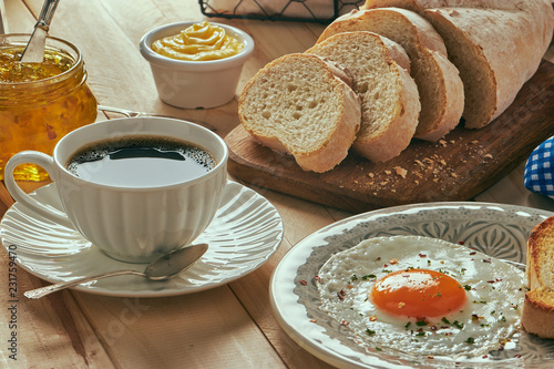 breakfast with egg, bread toast and coffe