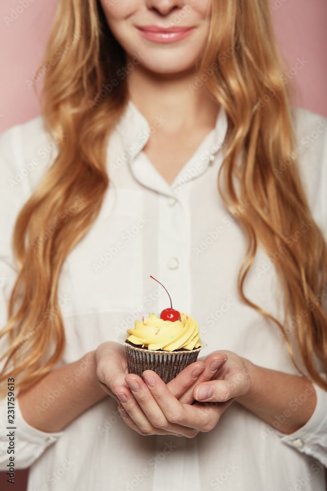 Woman hands holding a delicious yummy cupcake Woman hands holding a delicious yummy cupcake
