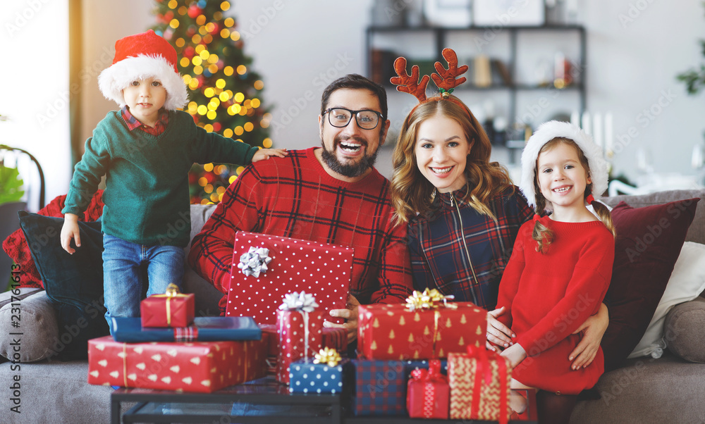 happy family open presents on Christmas morning happy family open presents on Christmas morning