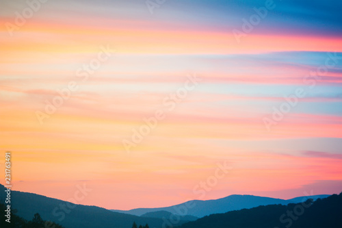 Fire Sunset at mountains. Sky and clouds texture
