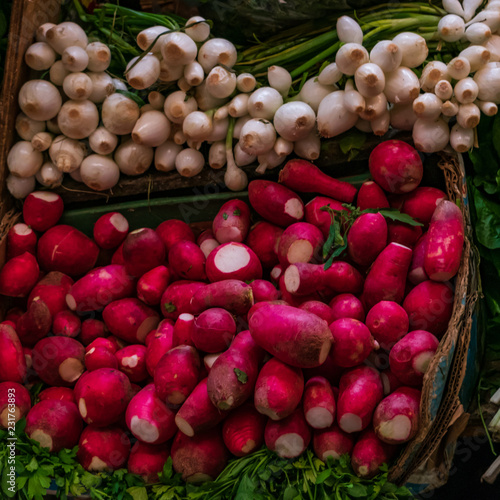 Background with fresh radishes and onions