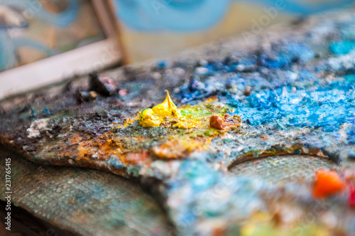 Artistic palette with oils paints. Paint for painting on canvas.
