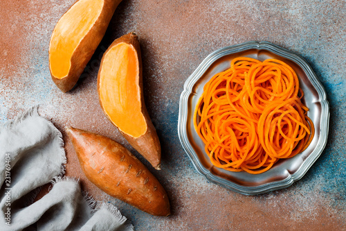 Spiralized sweet potato spaghetti. Low carb vegetable pasta cooking photo