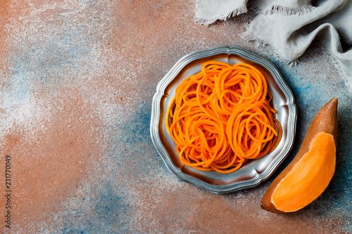 Spiralized sweet potato spaghetti. Low carb vegetable pasta cooking photo