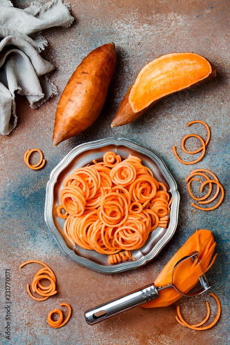 Spiralized sweet potato spaghetti. Low carb vegetable pasta cooking photo