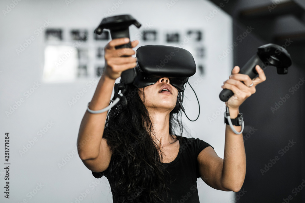 South-East asian girl playing VR game South-East asian girl playing VR game
