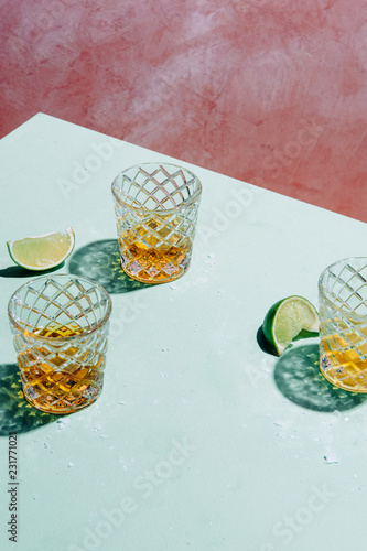 Three tequila shots with lime