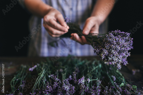 Woman arranging lavender bouquet