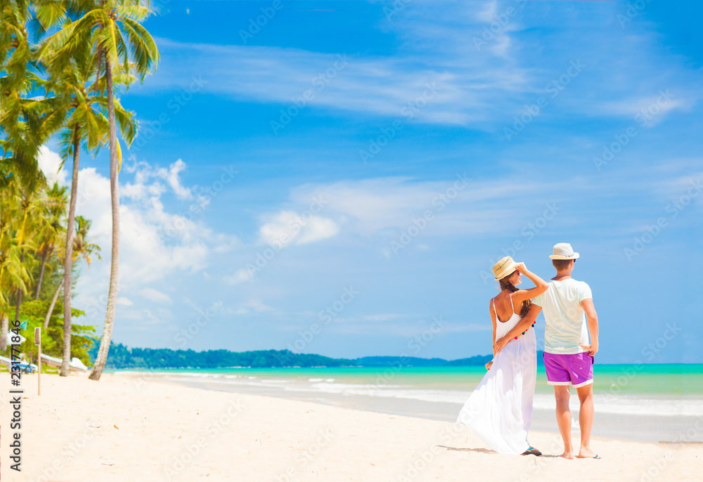 young couple on their honeymoon having fun by tropical beach young couple on their honeymoon having fun by tropical beach