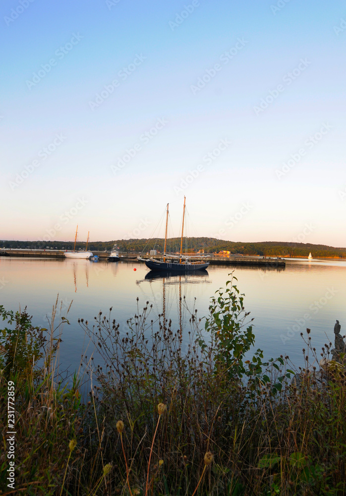 Sailing Boat In A Calm Harbor