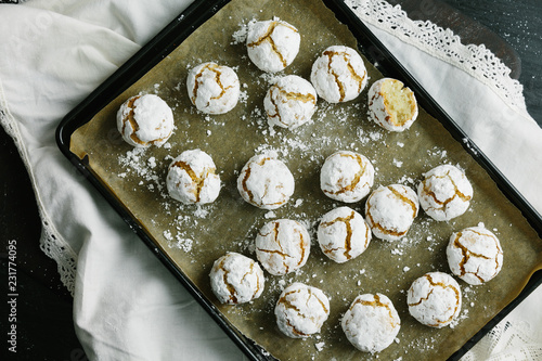 Tray of baked Amaretti Biscuits with one split open photo