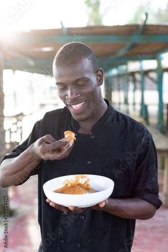 Man eating fufu and soup photo