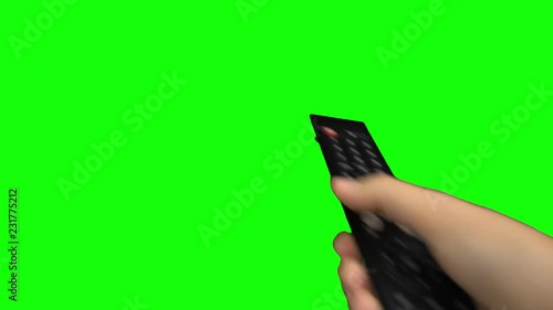 Black remote control television changing one channel . Green screen photo