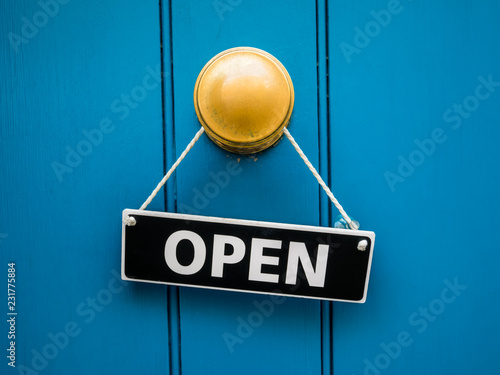 Blue shop door with open sign photo