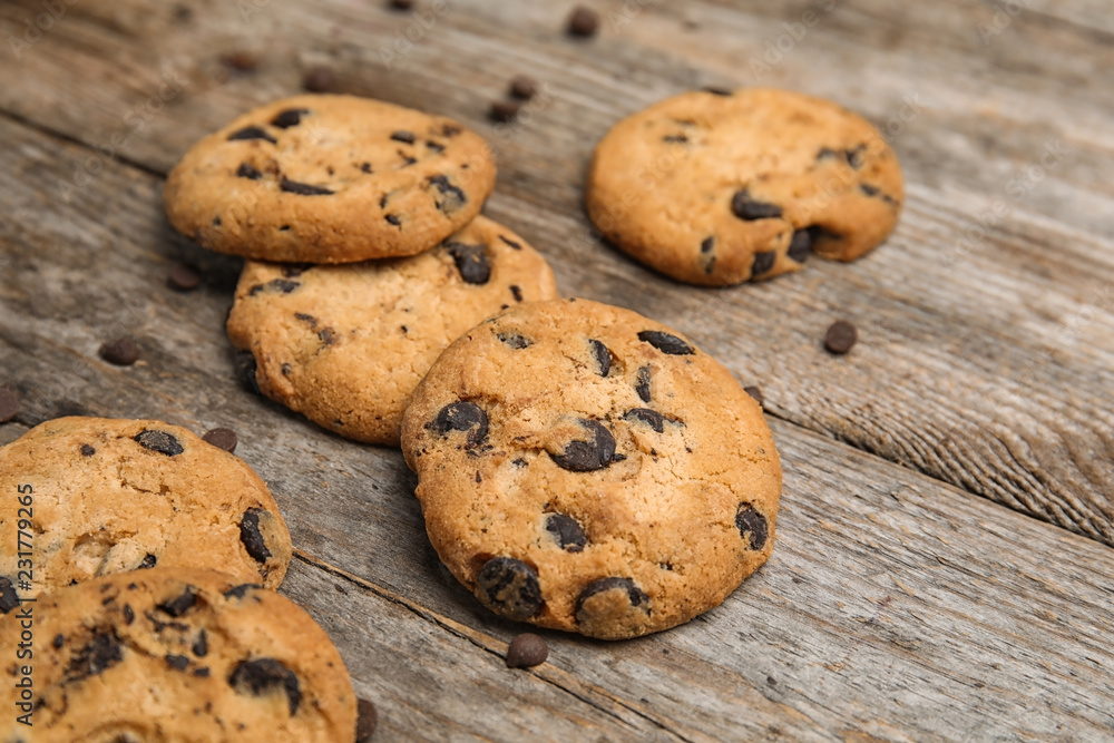 Delicious chocolate chip cookies on wooden table Delicious chocolate chip cookies on wooden table