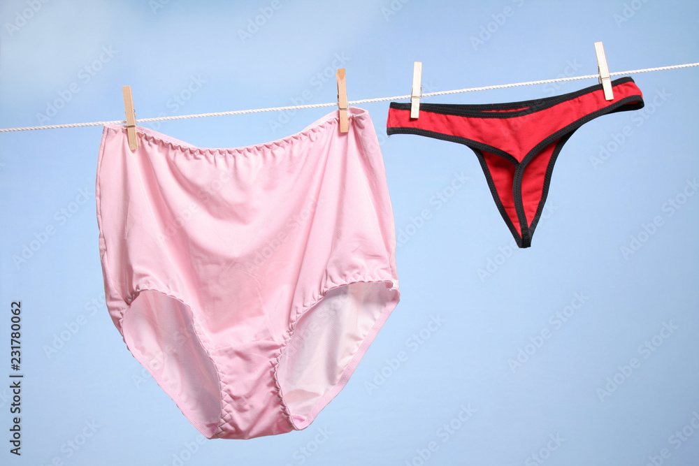 Granny's panties and sexy thong hanging on a clothesline фотография St...