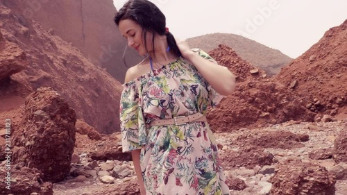 A woman in red desert,Morocco nature photo