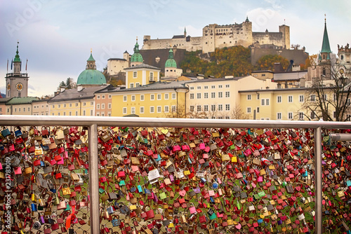 Salzburg cityscape view from Makartsteg bridge. Love locks at Makartsteg bridge on Salzach river and view to the fortress.