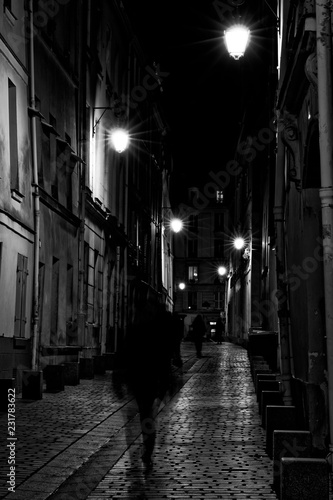 Paris, France - November 1, 2018: View of a street in the night after rain in Paris