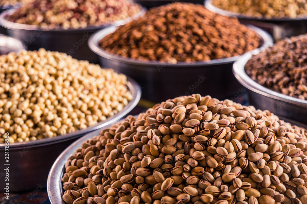 A mixture of nuts on the market. Various nuts in the store, juicy snacks sold in the market. Food for vegetarians. Ingredient for cooking and sweets. A mixture of nuts on the market. Various nuts in the store, juicy snacks sold in the market. Food for vegetarians. Ingredient for cooking and sweets.