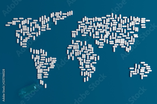 Background of scattered on a plain blue background of many tablets in the form of a silhouette of the continents of the world 3d illustration