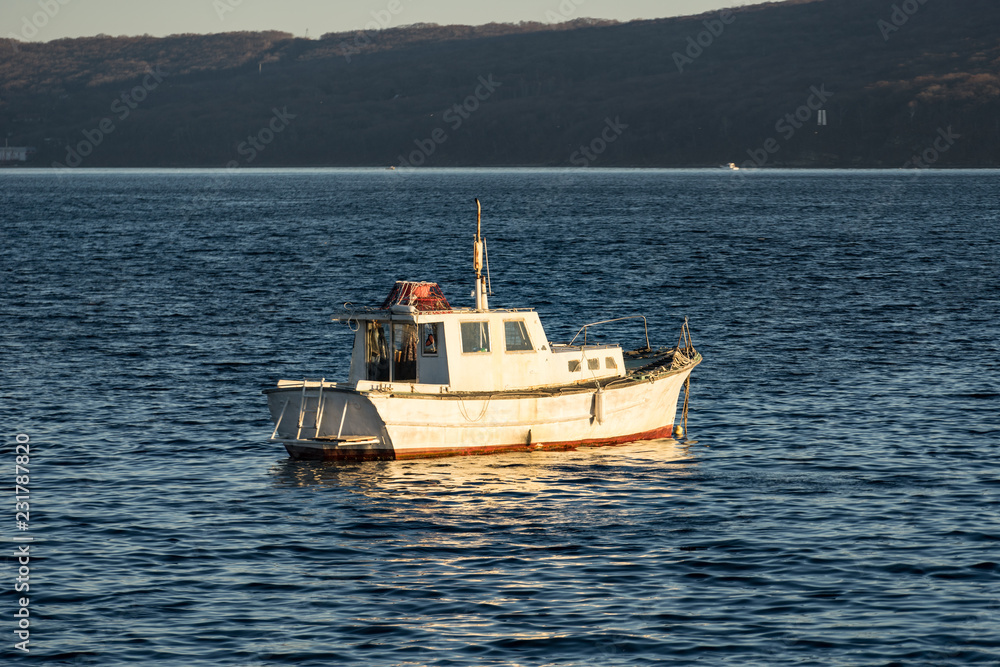seascape with a boat on the background of the sea. seascape with a boat on the background of the sea.