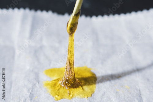 THC concentrated rosin being vertically stretched with dab tool